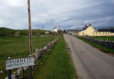 Durness and Diùranais road sign beside a lane leading into the village