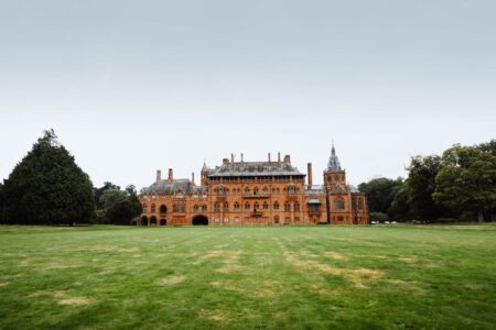 Mount Stuart's red sandstone front across the lawns.