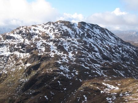 Beinn Chabhair's rocky flanks streaked with snow.