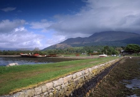 The shore at Airds Bay with Loch Etive and the hills beyond.