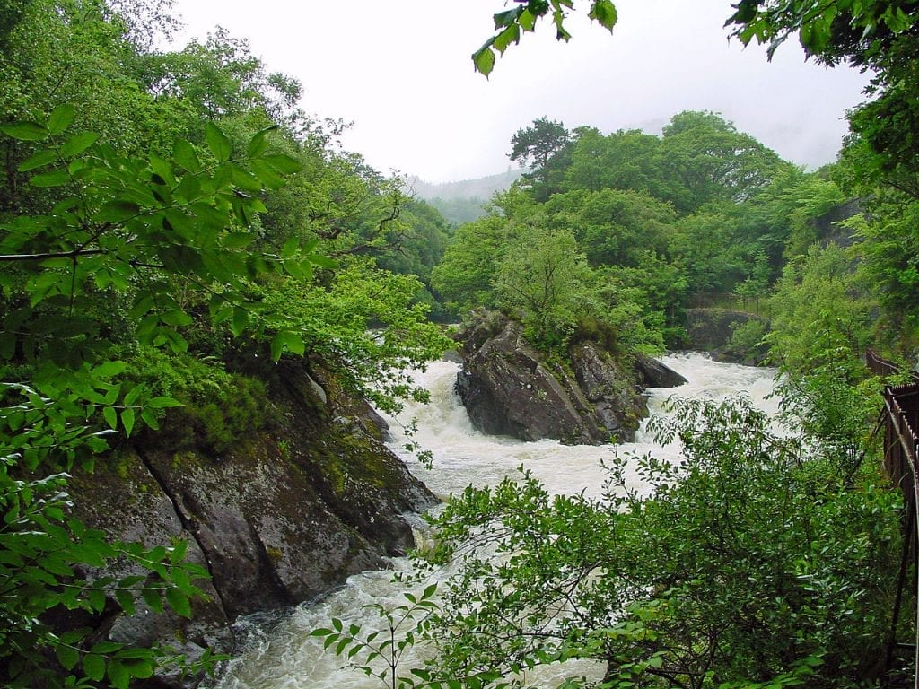 White water pouring over rocks at the Falls of Leny.