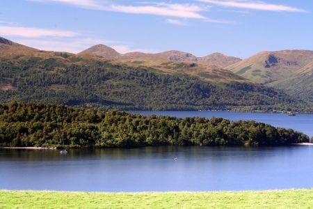 Inchmurrin's wooded shore on Loch Lomond, the hills beyond.