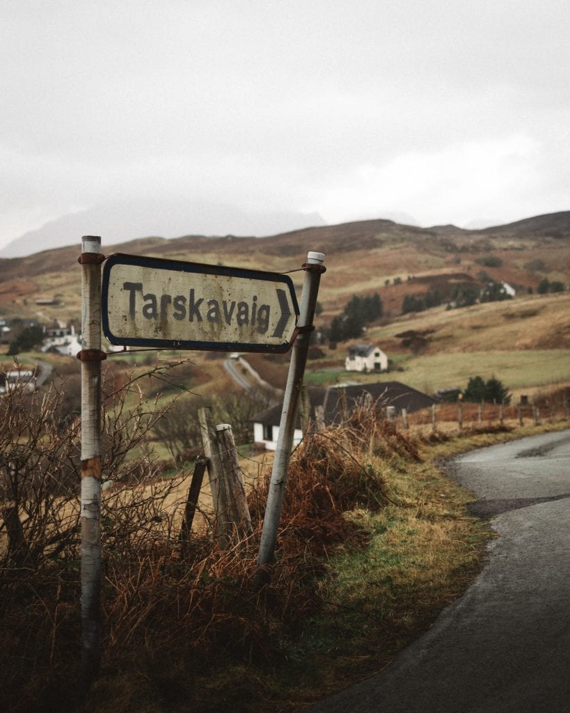 The road sign for Tarskavaig above the bay.