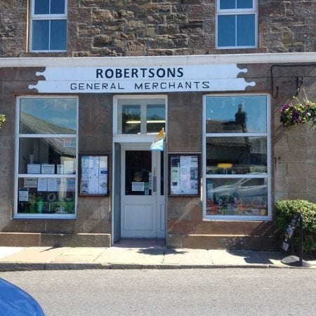The front of Robertsons in St Margaret's Hope, its old General Merchants sign over the door.