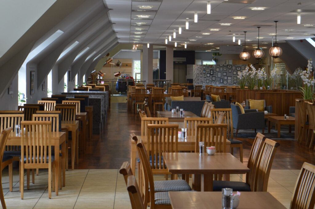 The Mains of Drum's upstairs restaurant, a long room of wooden tables under the roof.