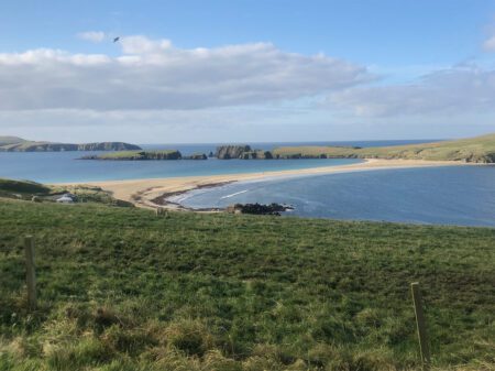 The white sand tombolo curving out to St Ninian's Isle, the sea on both sides.
