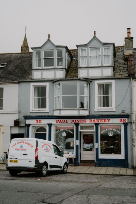 Paul Jones Bakery shopfront at numbers 28-30, with delivery van parked outside