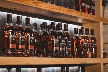 Shelves of Jura whisky bottles in the distillery shop.