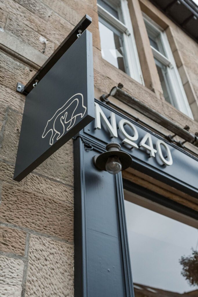 The No.40 sign with its little bear over the door.