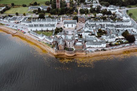 The white houses of Inveraray on their point in Loch Fyne, from above.