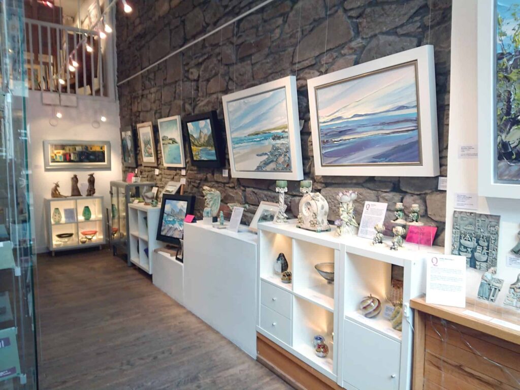 Paintings and ceramics on display inside Gallery Q, Dundee.