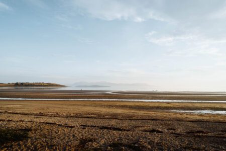 The wide sands of Ettrick Bay at low tide.
