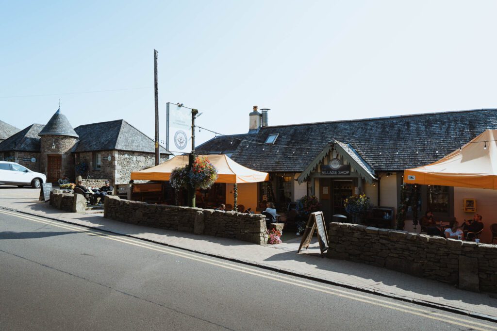 St Mocha's terrace under orange awnings on the Balmaha street.