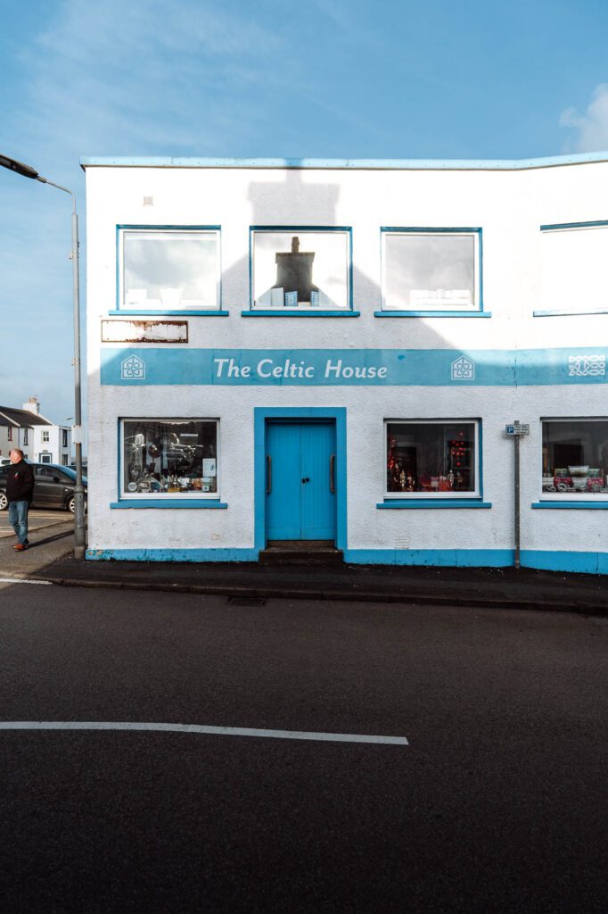 The Celtic House in Bowmore, a white front trimmed in blue, its name above the door.