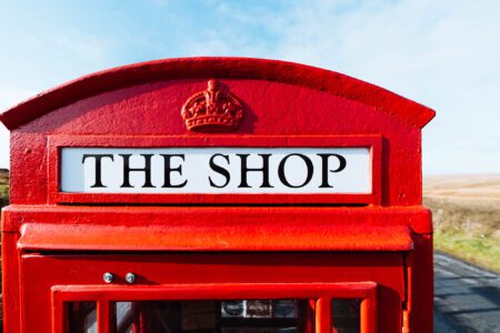 The crown and the words THE SHOP on the red telephone box.
