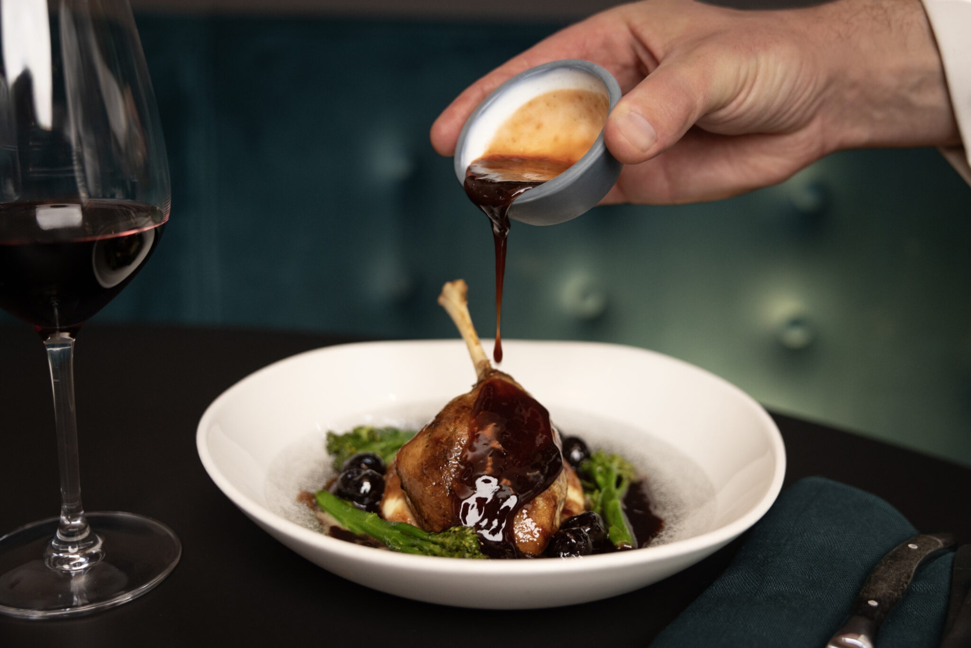 Duck leg with a rich sauce at Daisy Tasker.