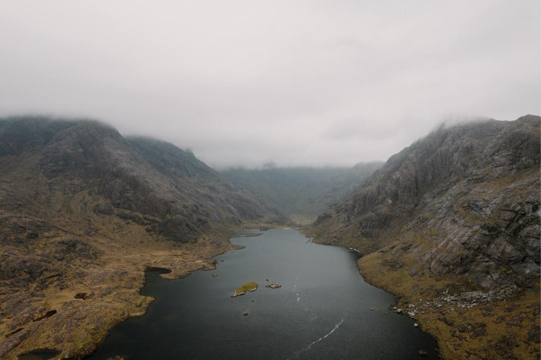 Loch Coruisk running back between the steep walls of the Cuillin ridge under low cloud.