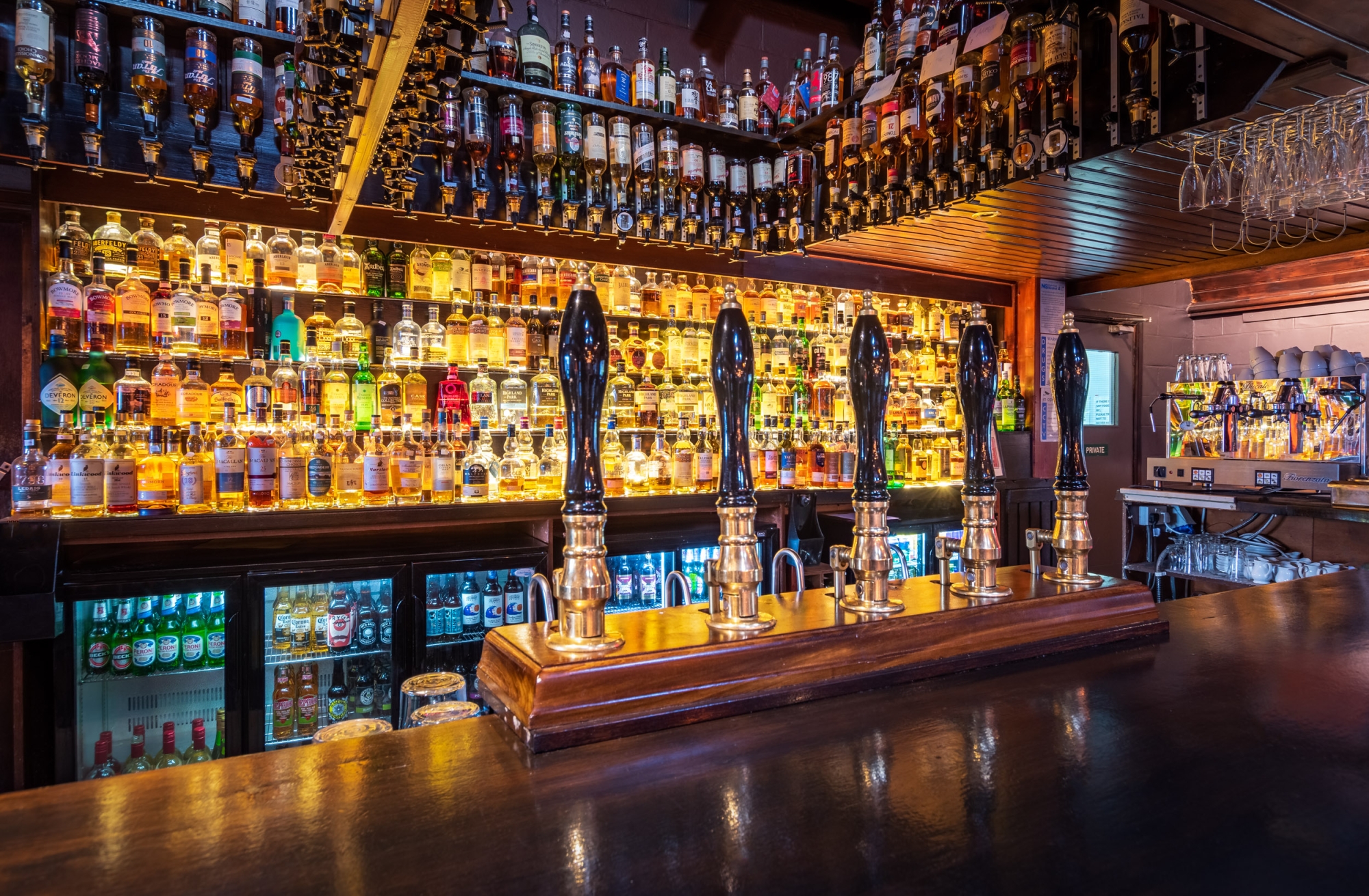 The back bar at Seumas' lined with whiskies.