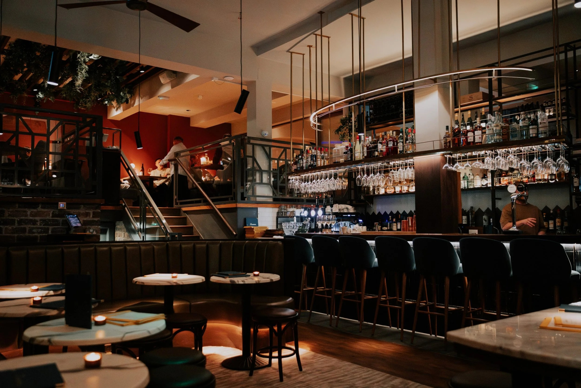The dining room and bar under warm lights.